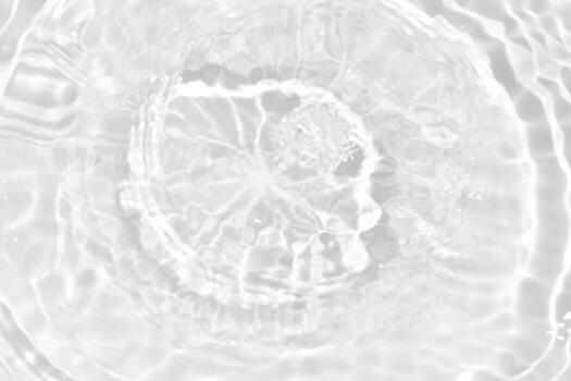 Defocus blurred transparent blue colored clear calm water surface texture with splashes and bubbles. Trendy abstract nature background. Water waves in sunlight with copy space. Blue watercolor shining photo