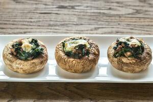 Baked mushrooms stuffed with spinach and cheese photo