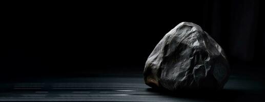 Musgravite is a rare precious natural geological stone on a black background in low key. AI generated. photo