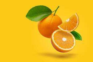 Creative layout made from fresh orange fruit on a pastel orange background. Fruit minimal concept and copy space. photo