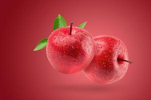 Fresh red apple isolated on a red background. photo