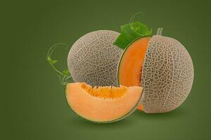 Orange melon or cantaloupe melon with seeds isolated on green background photo