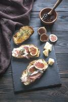 Toasts with bacon and figs photo