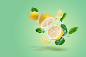 Creative layout made form Lemon fruit and lemon slices and water splashing on a green background. photo
