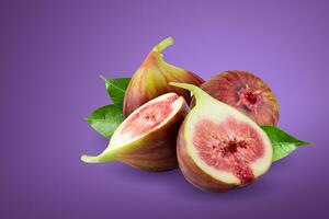 Fresh figs fruit isolated on a purple background. photo