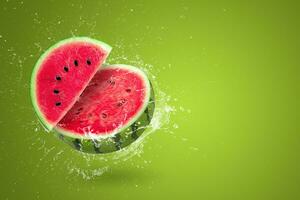 Water splashing on Sliced watermelon fruit isolated on green background photo
