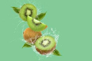 Creative layout made from Sliced of kiwi and water Splashing on a green background. photo