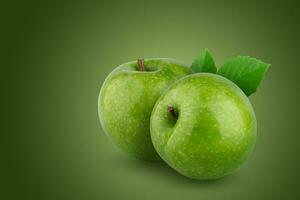 Fresh green apple isolated on green background. photo