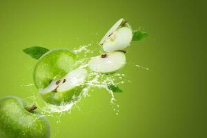 Creative layout made from Green Apple and water splashing on a green background. photo
