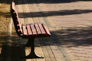 Bench for rest in a city park on the shores of the Mediterranean Sea. photo