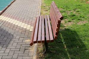 Bench for rest in a city park on the shores of the Mediterranean Sea. photo