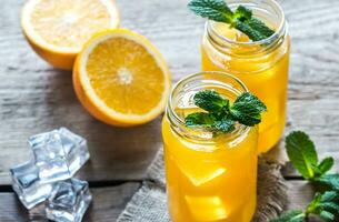 vaso frascos de naranja jugo foto