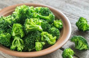 Cooked broccoli on the plate photo