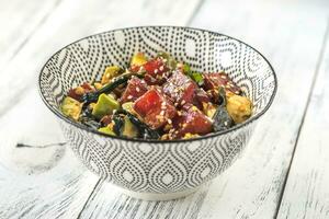 Bowl of poke - traditional Hawaiian dish photo