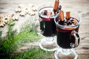 Two glasses of mulled wine with fir branch photo