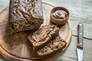 Loaf of banana-chocolate bread with chocolate cream photo