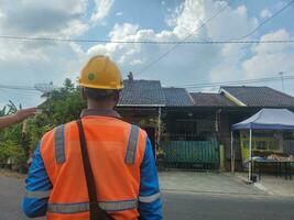 Officers from PLN are replacing electricity lines photo