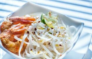 Rice noodles with shrimps and bean sprouts photo
