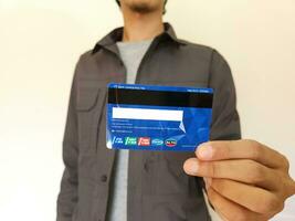 man showing BCA debit Card photo