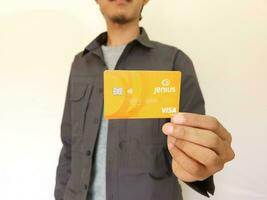 man showing Jenius Card, digital banking, debit cards photo