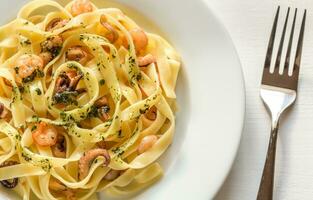 Tagliatelle pasta with seafood photo