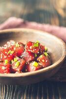 Bowl of poke - traditional Hawaiian dish photo