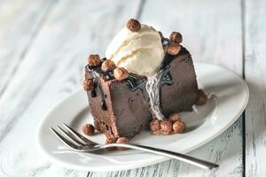 Chocolate brownie with vanilla ice cream photo