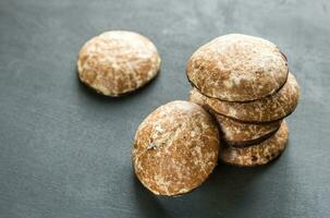 Gingerbread cakes on the wooden background photo