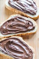 Slices of baguette with chocolate cream photo