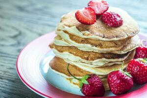Pancakes with strawberry jam photo
