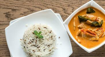 Thai panang curry with bowl of white and wild rice photo