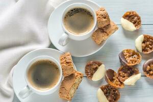 Cups of coffee with florentine cookies photo