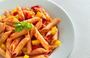 Penne with tomato sauce and fresh pepper photo