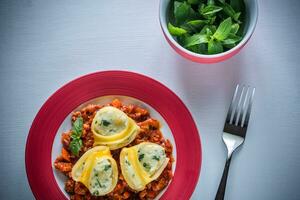 Lumaconi stuffed with ricotta with bolognese sauce photo