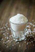 Glass of sea salt photo