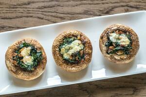 Baked mushrooms stuffed with spinach and cheese photo