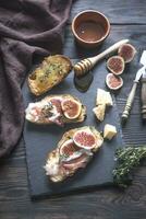 Toasts with bacon and figs photo