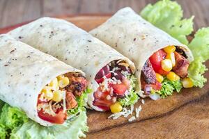 Three chicken burritos photo