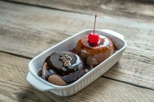 Coffee panna cotta under chocolate and strawberry topping photo