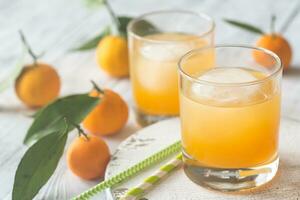 Two glasses of orange juice photo