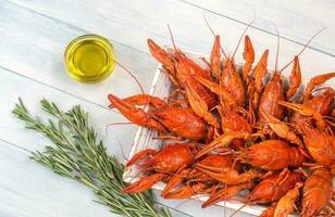 Tray with boiled crayfish photo