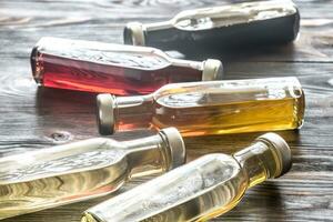 Bottles with different kinds of vinegar photo