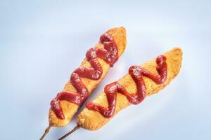 Corn dogs on the white background photo