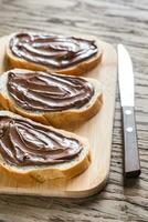 Slices of baguette with chocolate cream photo