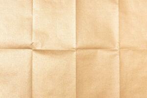 Golden folded paper texture background. Full frame photo