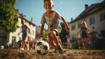 Boy playing with soccer ball in the yard of his house on a sunny day. photo