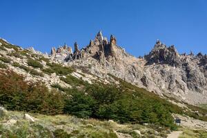 View of top of mountain with a blue sky photo