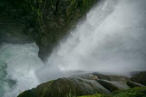 Waterfall Pailon del Diablo in the forest in Ecuador photo