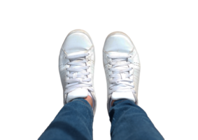 Top view of white sneakers and Blue jeans on woman legs on transparent png