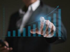 Businessman or trader showing hologram business growth, investing in trading, Planning and strategy, Stock market, Business growth, Progress success concept photo